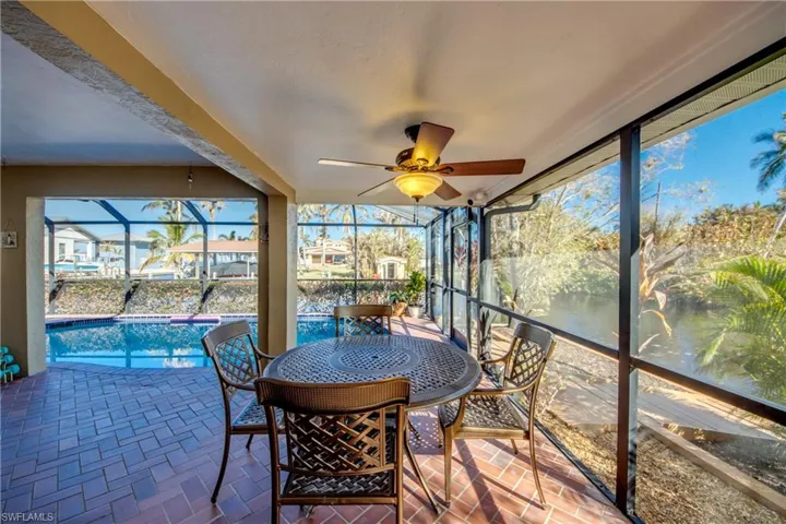 Unique wrap around Lanai offers multiple choices for covered sitting areas all with views of the waterway and access to the lovely swimming pool. All of the sliding glass doors are impact rated and pocket back allowing a fantastic flow for entertaining and allowing for the wonderful River breezes. Views from the Pool area feature River and Sunset views.