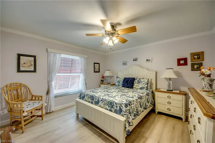 Lovely spacious guest room features LVP flooring, ample closet space, crown molding and is located in the guest wing of the home adjacent to the newly remodeled guest bathroom.