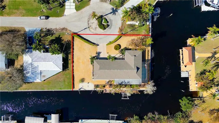 Located at the end of a quite Cul-de-sac in the sought after Iona McGregor corridor. Quick Direct Gulf Access! Canal Frontage on 2 sides and straight out to the Caloosahatchee Intracoastal Waterway! Just minutes to Sanibel, the back bay or the gulf of Mexico! Dock with a 10,000lb boat lift and davits for a small boat or jet skis right behind your home! Enjoy River views from your Kitchen window, Lanai, Pool Deck and Master Bedroom.