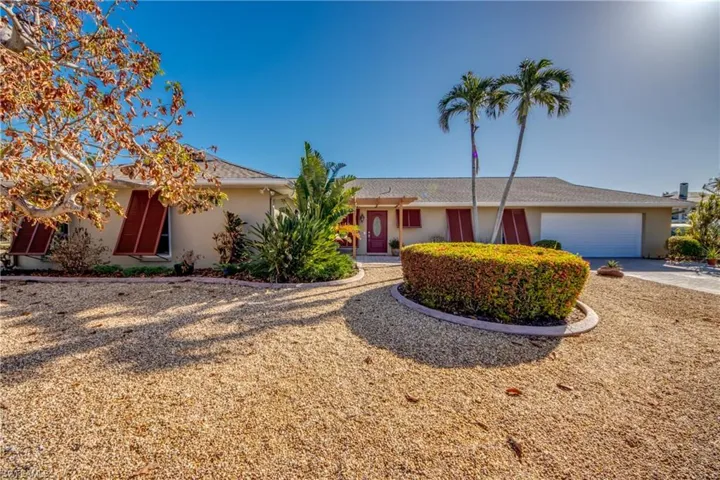Delightful updated Pool home located on a quite cul-de-sac. Features approximately 239 Ft of water frontage just off the Caloosahatchee River. NO Bridges. Just minutes by boat to Sanibel, Back Bay or the Gulf of Mexico! Features Dock with 10 lb boat lift and davits for your smaller boat or jet skis. Meticulously maintained and upgraded. Wrap around Lanai with water views and sunset views from the Pool deck & Lanai! Home boast all impact windows and sliders, new HVAC system, Dock and Lift, and much more!