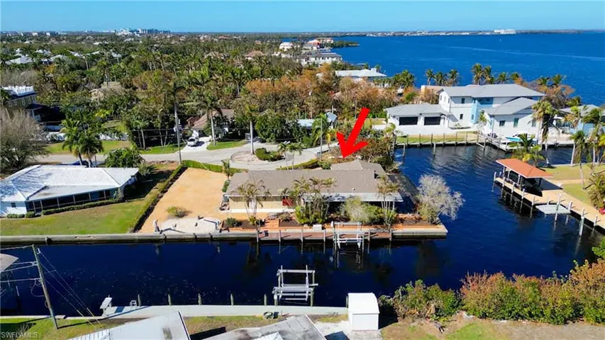 Aerial View shows quick Gulf access with NO Bridges to the Gulf of Mexico!Located at the end of a quite Cul-de-sac in the sought after Iona McGregor corridor. Quick Direct Gulf Access! Canal Frontage on 2 sides and straight out to the Caloosahatchee Intracoastal Waterway! Just minutes to Sanibel, the back bay or the gulf of Mexico! Dock with a 10,000lb boat lift right behind your home and davits for a small boat or jet skis. River views from your Kitchen window, Lanai, Pool Deck and Master Bedroom.