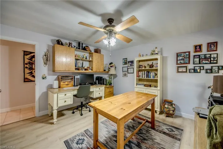 Spacious guest bedroom currently used as a home office. Features LVP flooring, 2 large impact rated windows, and an ample sized closet. Located in the guest wing of the home next to the guest bathroom.
