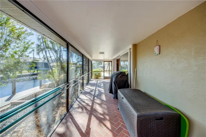 Unique wrap around Lanai offers multiple choices for covered sitting areas all with views of the waterway and access to the lovely swimming pool. All of the sliding glass doors are impact rated and pocket back allowing a fantastic flow for entertaining and allowing for the wonderful River breezes.