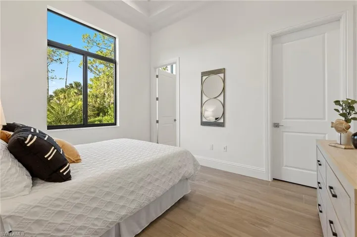 Bedroom with light hardwood / wood-style flooring