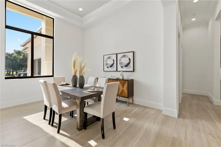 Dining area with light hardwood / wood-style flooring