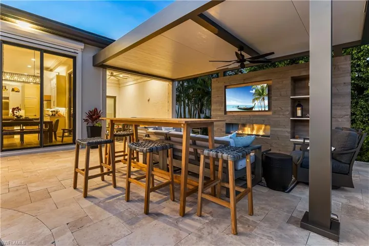 This is your outdoor oasis! Fireplace, T.V. seating/relaxing area.