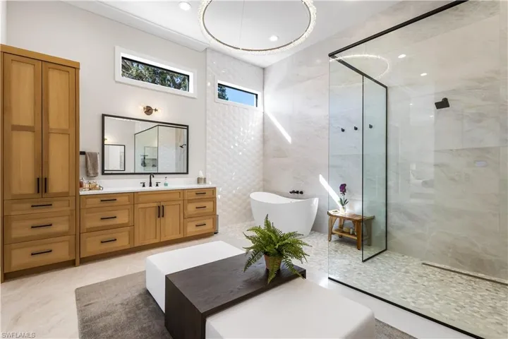 This is your spa zone! Soaking zen tub with enormous walk in shower. Huge tile runs floor to ceiling with a wonderful seating area!