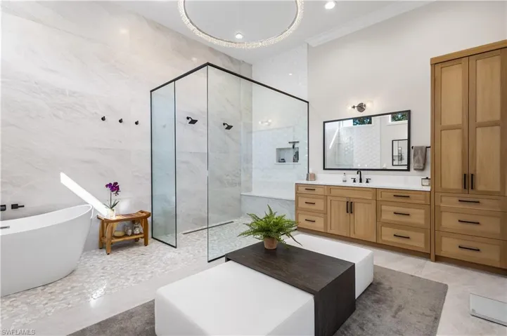 This is your spa zone! Soaking zen tub with enormous walk in shower. Huge tile runs floor to ceiling with a wonderful seating area!