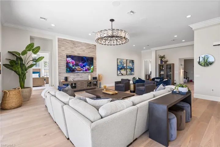 Temperature controlled Wine Cellar with glass doors, 12ft Trey Ceiling 10ft stackable sliders Hurricane Protection- Electric Hurricane Shutters, White Oak flooring & Stacked stone TV entertainment wall.