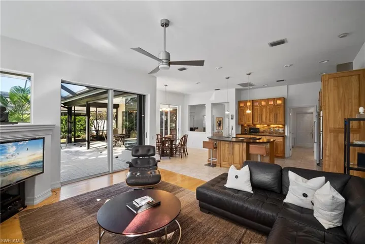 Living room with plenty of natural light and light hardwood / wood-style flooring