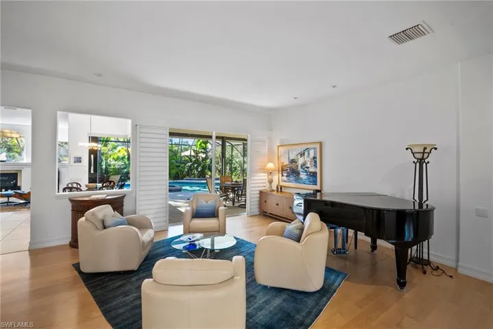 Living room featuring light hardwood / wood-style flooring and an inviting chandelier