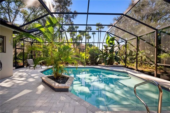 View of pool featuring a lanai and a patio area