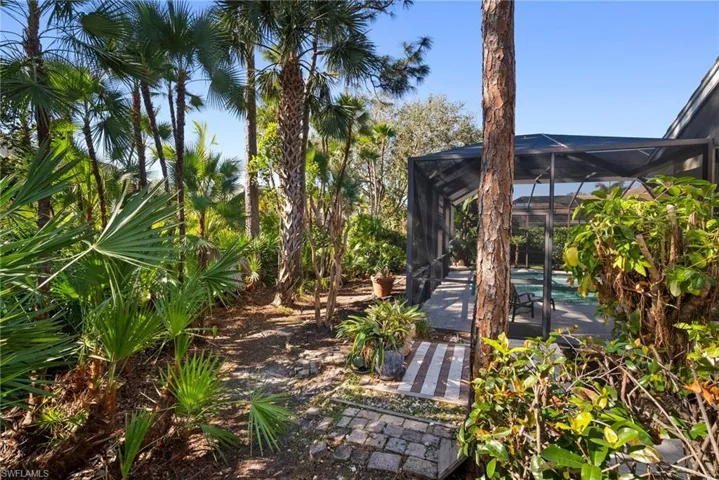 View of yard featuring glass enclosure