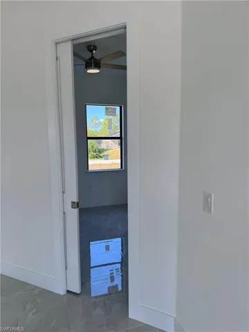 Hall featuring baseboards