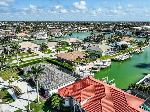 Drone / aerial view featuring a residential view and a water view