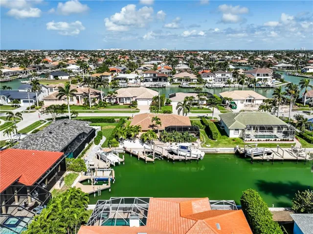 Drone / aerial view with a water view and a residential view