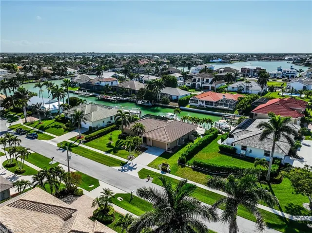 Drone / aerial view featuring a water view and a residential view