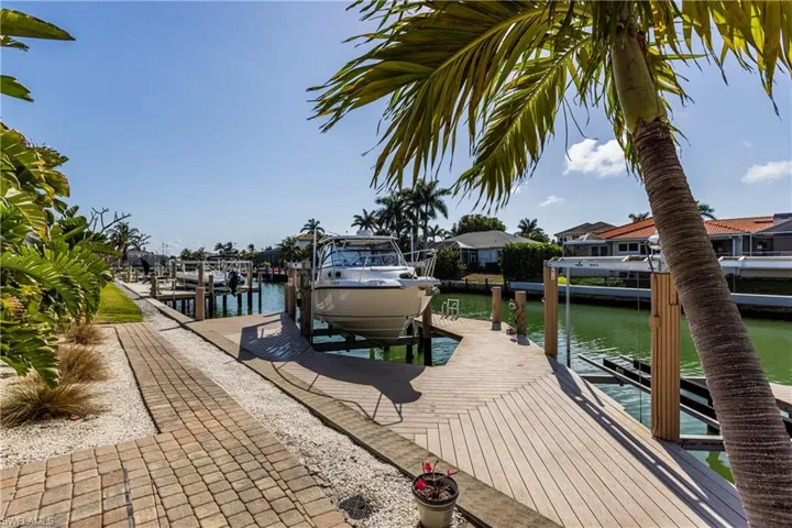View of dock featuring a water view and boat lift