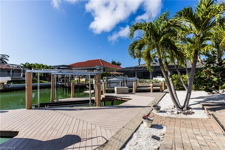 Dock area featuring a water view and boat lift