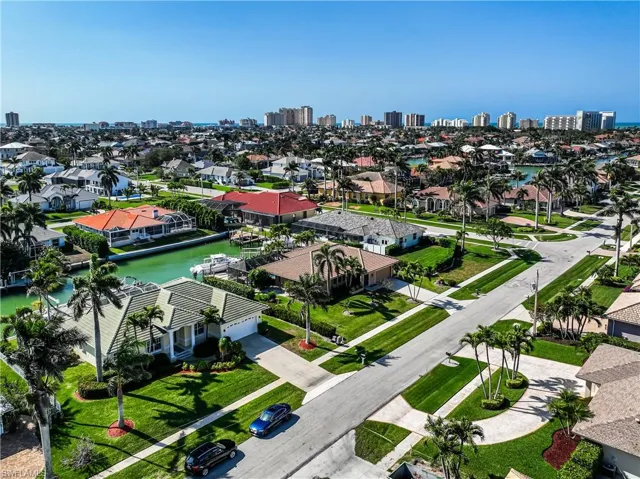 Aerial view featuring a water view, a residential view, and a city view