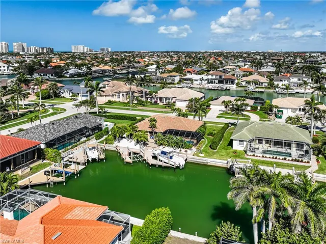 Aerial view with a water view and a residential view
