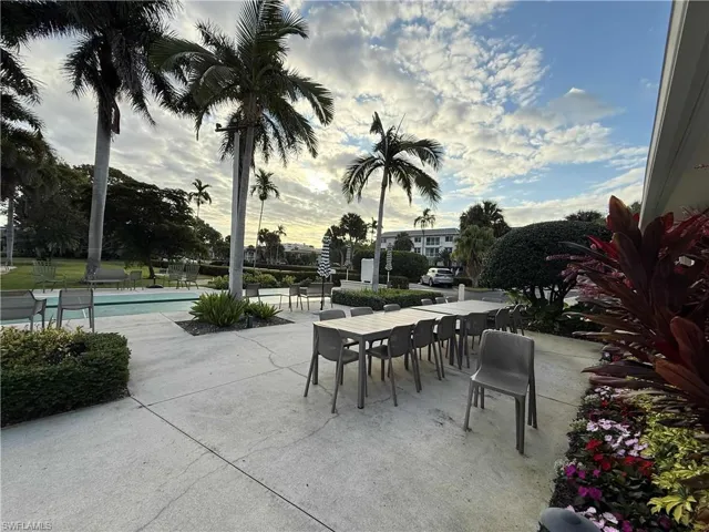 View of patio / terrace with outdoor dining common area surrounding clubhouse