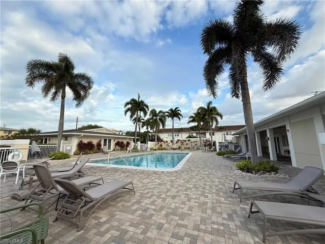 Community pool with a patio area