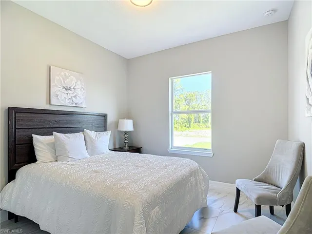 Bedroom with tile flooring