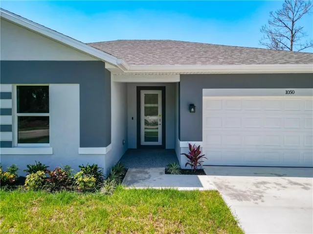 View of exterior entry featuring a garage