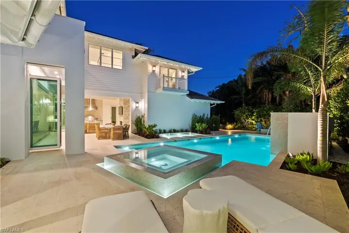 View of pool featuring an in ground hot tub, outdoor lounge area, and a patio