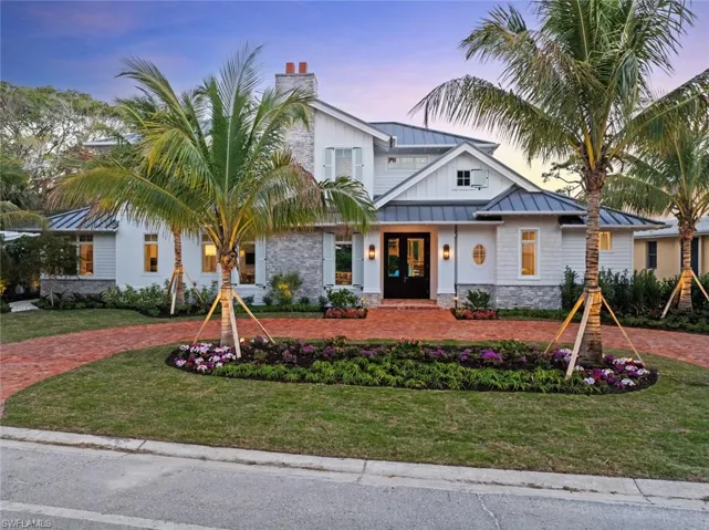 View of front of house with a yard