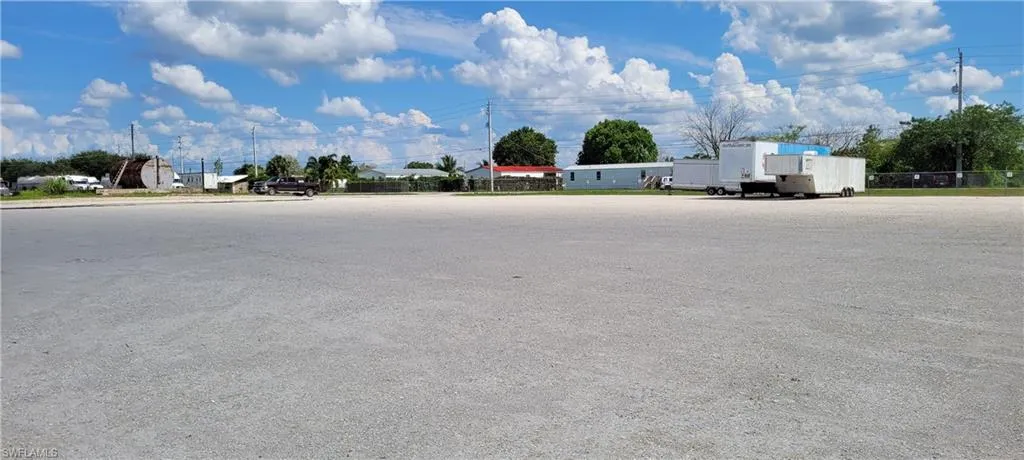 Up to two acres of secure parking area in Clewiston separated by fence and your own gate from the yard. DOT grade baserock and wide open turning area for large rigs and equipment. Just off of US Hwy 27.1855 Hookers Point RD, Clewiston, FL 33440