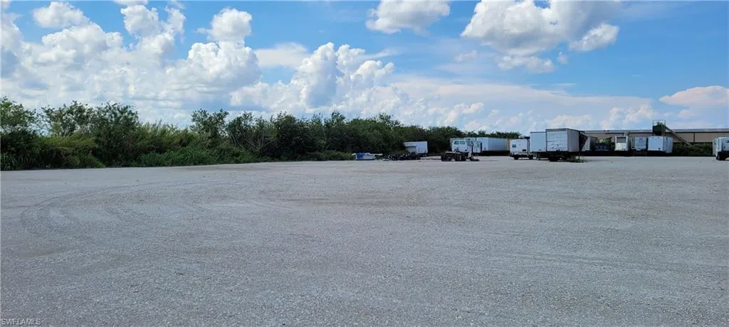 Up to two acres of secure parking area in Clewiston separated by fence and your own gate from the yard. DOT grade baserock and wide open turning area for large rigs and equipment. Just off of US Hwy 27.1855 Hookers Point RD, Clewiston, FL 33440