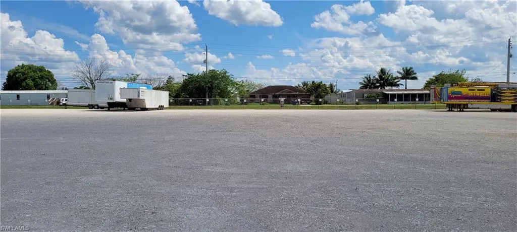 Up to two acres of secure parking area in Clewiston separated by fence and your own gate from the yard. DOT grade baserock and wide open turning area for large rigs and equipment. Just off of US Hwy 27.1855 Hookers Point RD, Clewiston, FL 33440