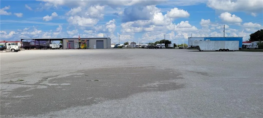 Up to two acres of secure parking area in Clewiston separated by fence and your own gate from the yard. DOT grade baserock and wide open turning area for large rigs and equipment. Just off of US Hwy 27.1855 Hookers Point RD, Clewiston, FL 33440