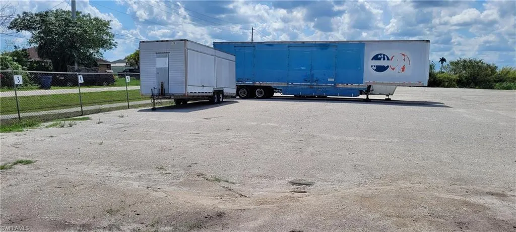 Up to two acres of secure parking area in Clewiston separated by fence and your own gate from the yard. DOT grade baserock and wide open turning area for large rigs and equipment. Just off of US Hwy 27.1855 Hookers Point RD, Clewiston, FL 33440