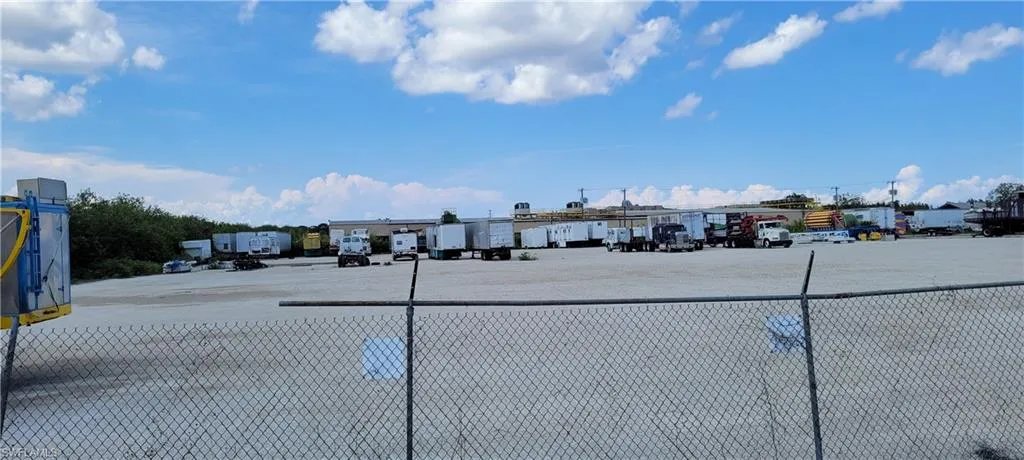 Up to two acres of secure parking area in Clewiston separated by fence and your own gate from the yard. DOT grade baserock and wide open turning area for large rigs and equipment. Just off of US Hwy 27.1855 Hookers Point RD, Clewiston, FL 33440