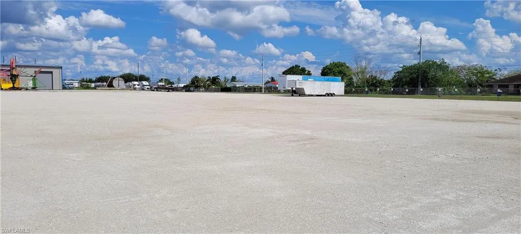 Up to two acres of secure parking area in Clewiston separated by fence and your own gate from the yard. DOT grade baserock and wide open turning area for large rigs and equipment. Just off of US Hwy 27.1855 Hookers Point RD, Clewiston, FL 33440