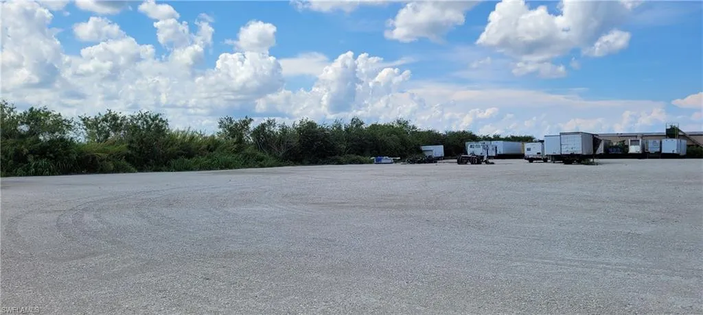 Up to two acres of secure parking area in Clewiston separated by fence and your own gate from the yard. DOT grade baserock and wide open turning area for large rigs and equipment. Just off of US Hwy 27.1855 Hookers Point RD, Clewiston, FL 33440