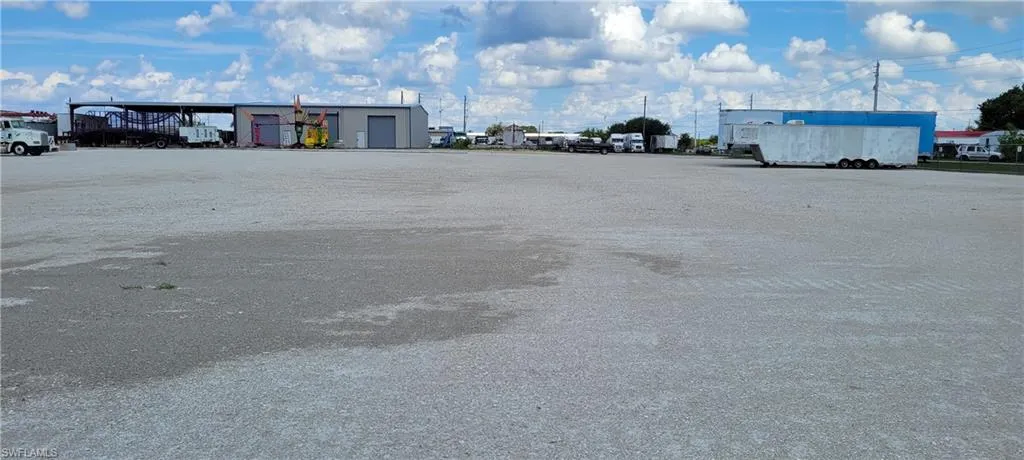 Up to two acres of secure parking area in Clewiston separated by fence and your own gate from the yard. DOT grade baserock and wide open turning area for large rigs and equipment. Just off of US Hwy 27.1855 Hookers Point RD, Clewiston, FL 33440