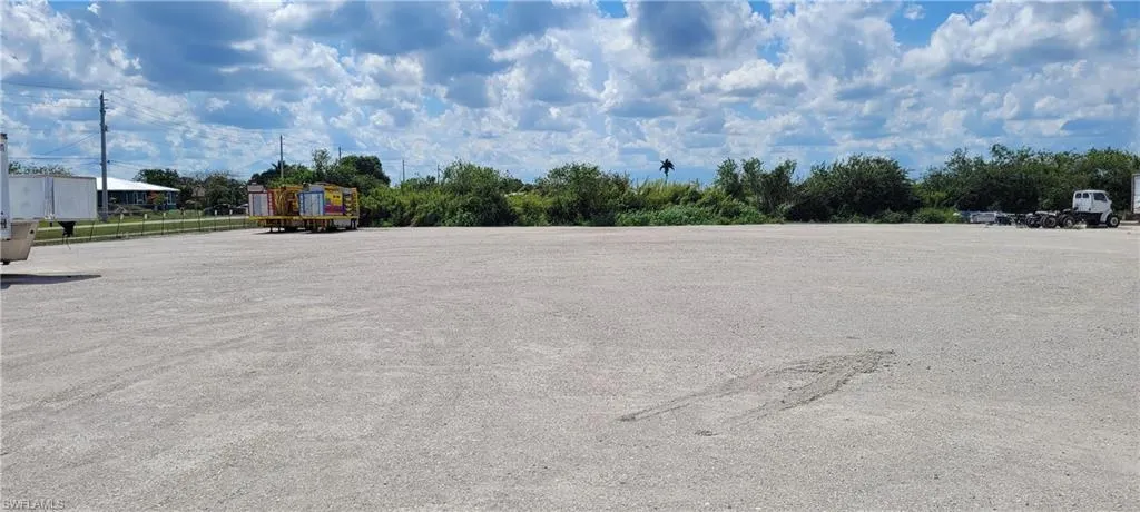 Up to two acres of secure parking area in Clewiston separated by fence and your own gate from the yard. DOT grade baserock and wide open turning area for large rigs and equipment. Just off of US Hwy 27.1855 Hookers Point RD, Clewiston, FL 33440