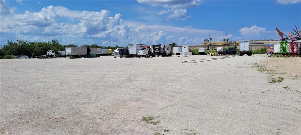Up to two acres of secure parking area in Clewiston separated by fence and your own gate from the yard. DOT grade baserock and wide open turning area for large rigs and equipment. Just off of US Hwy 27.1855 Hookers Point RD, Clewiston, FL 33440