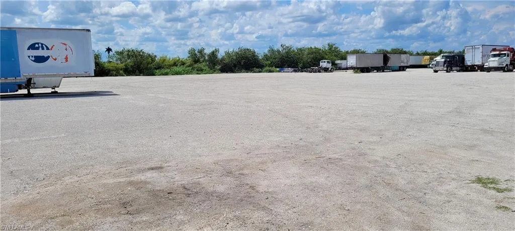Up to two acres of secure parking area in Clewiston separated by fence and your own gate from the yard. DOT grade baserock and wide open turning area for large rigs and equipment. Just off of US Hwy 27.1855 Hookers Point RD, Clewiston, FL 33440