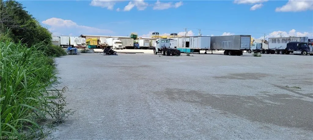 Up to two acres of secure parking area in Clewiston separated by fence and your own gate from the yard. DOT grade baserock and wide open turning area for large rigs and equipment. Just off of US Hwy 27.1855 Hookers Point RD, Clewiston, FL 33440