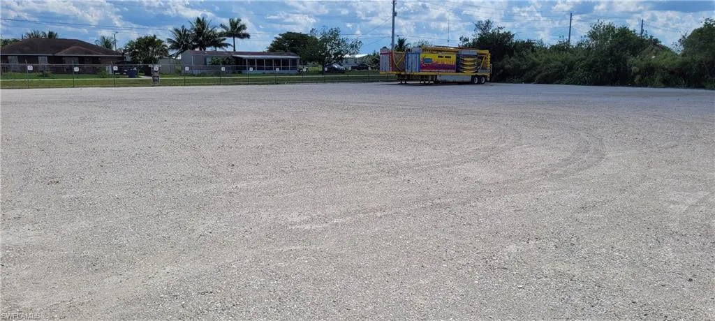 Up to two acres of secure parking area in Clewiston separated by fence and your own gate from the yard. DOT grade baserock and wide open turning area for large rigs and equipment. Just off of US Hwy 27.1855 Hookers Point RD, Clewiston, FL 33440