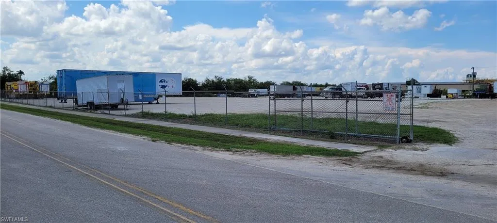 Up to two acres of secure parking area in Clewiston separated by fence and your own gate from the yard. DOT grade baserock and wide open turning area for large rigs and equipment. Just off of US Hwy 27.1855 Hookers Point RD, Clewiston, FL 33440