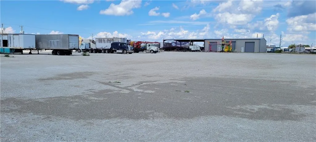 Up to two acres of secure parking area in Clewiston separated by fence and your own gate from the yard. DOT grade baserock and wide open turning area for large rigs and equipment. Just off of US Hwy 27.1855 Hookers Point RD, Clewiston, FL 33440