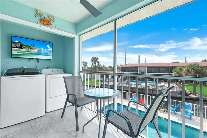 Screened-in balcony, metal railings, and a recessed wall niche