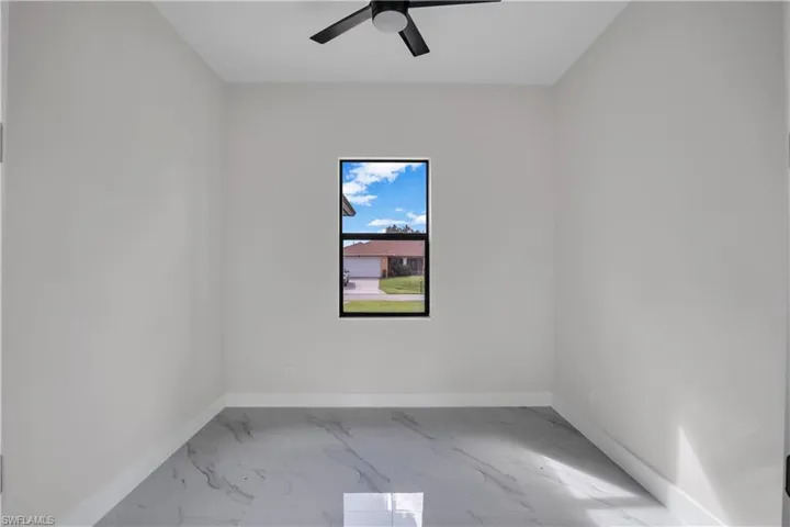 Spare room featuring ceiling fan
