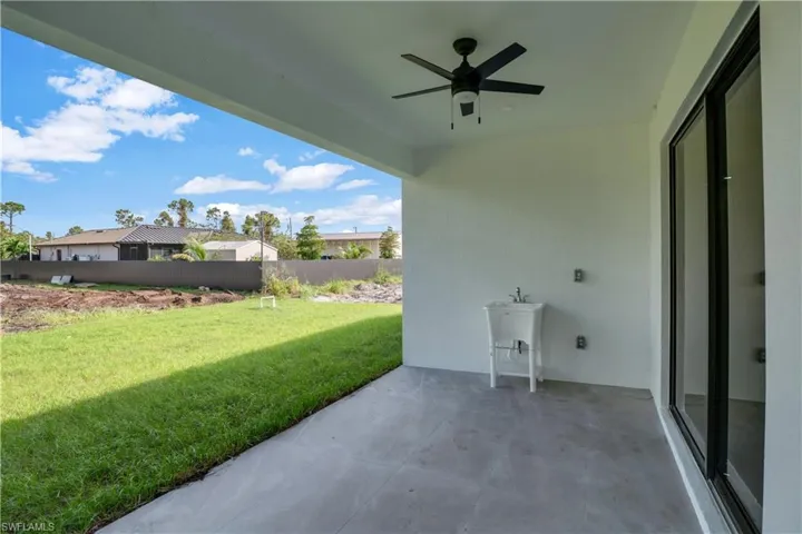 View of patio featuring ceiling fan